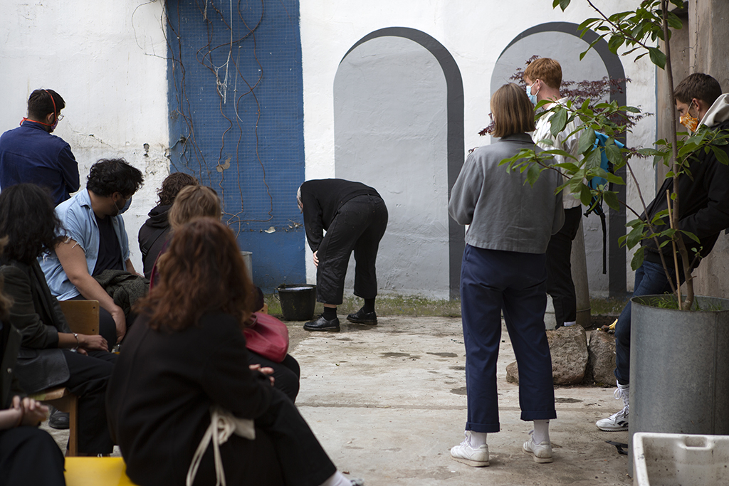 Bending over a bucket reading like retching